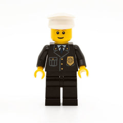 LEGO cty0005 -Police (City Suit with Blue Tie and Badge, Black Legs, White Hat, Brown Eyebrows, Thin Grin)